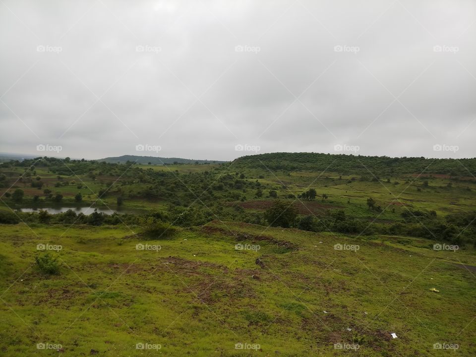 BBB.One fine morning cloudy nature's with green and grassland  in the middle of natural water.. views ..it's like amazing.