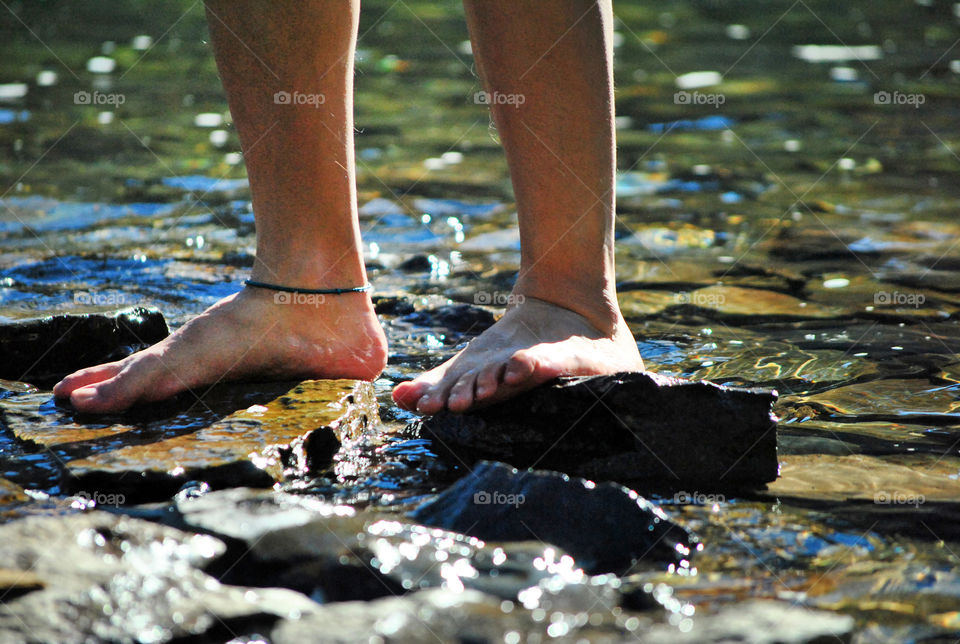 bare Feet on waterfalls feeling the cold water