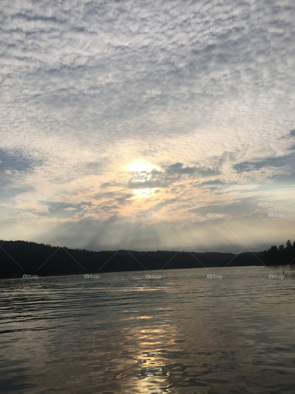 sunset on the lake . This photo was taken on the lake during a boat ride 