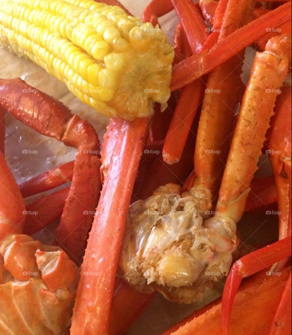 Fresh caught and boiled crab legs with corn