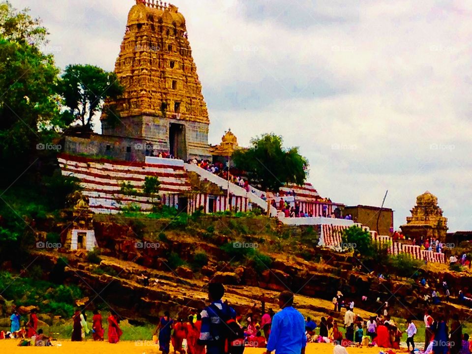 Hindu Temple on the river bed. Devotees visiting the Temple .