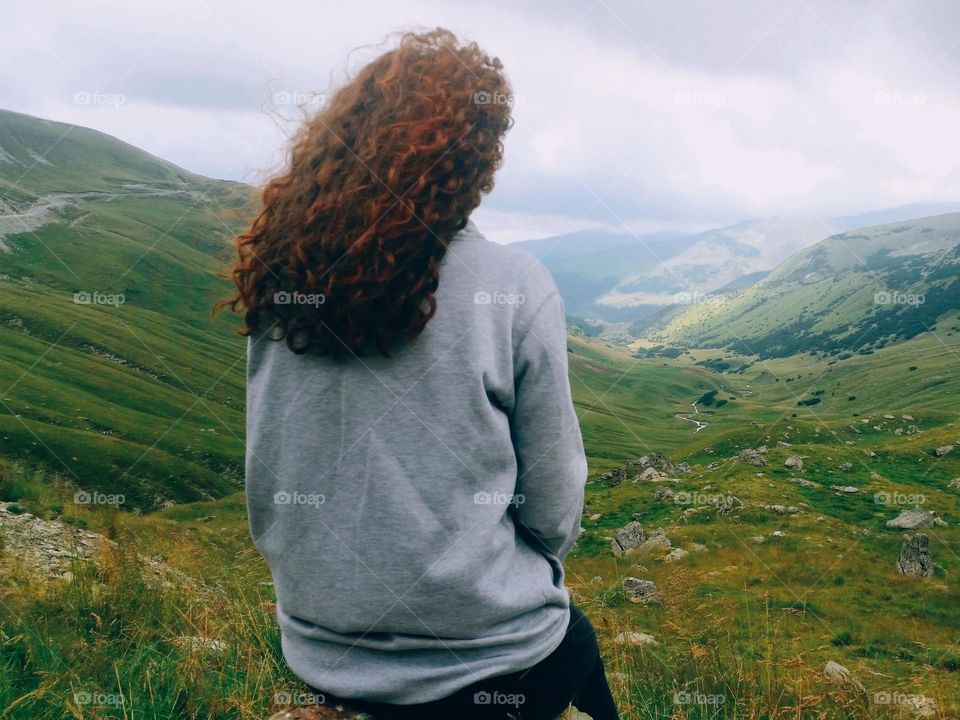 the girl with the curly red hair