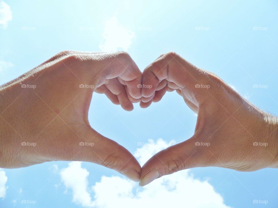 Human hand making a heart shape