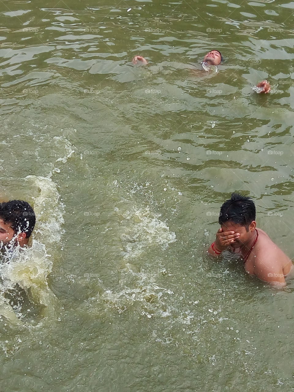 people bahting in river