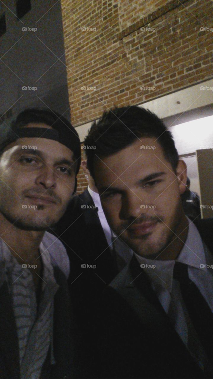 Sneaking in movie premieres . Exclusive shot with Taylor Lautner !