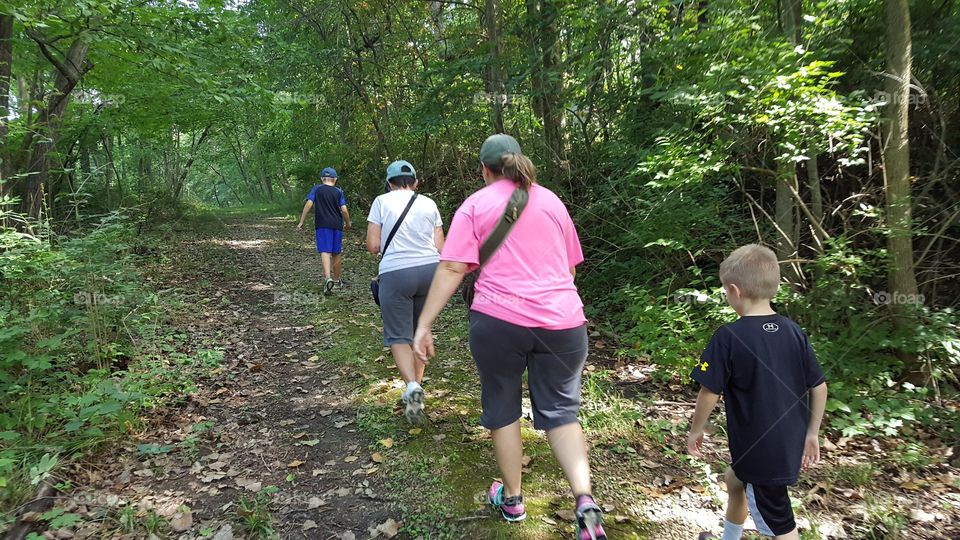 family hiking in the woods