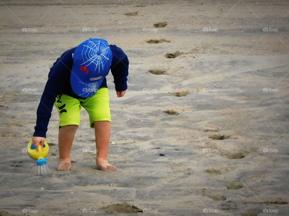 Watering the sand