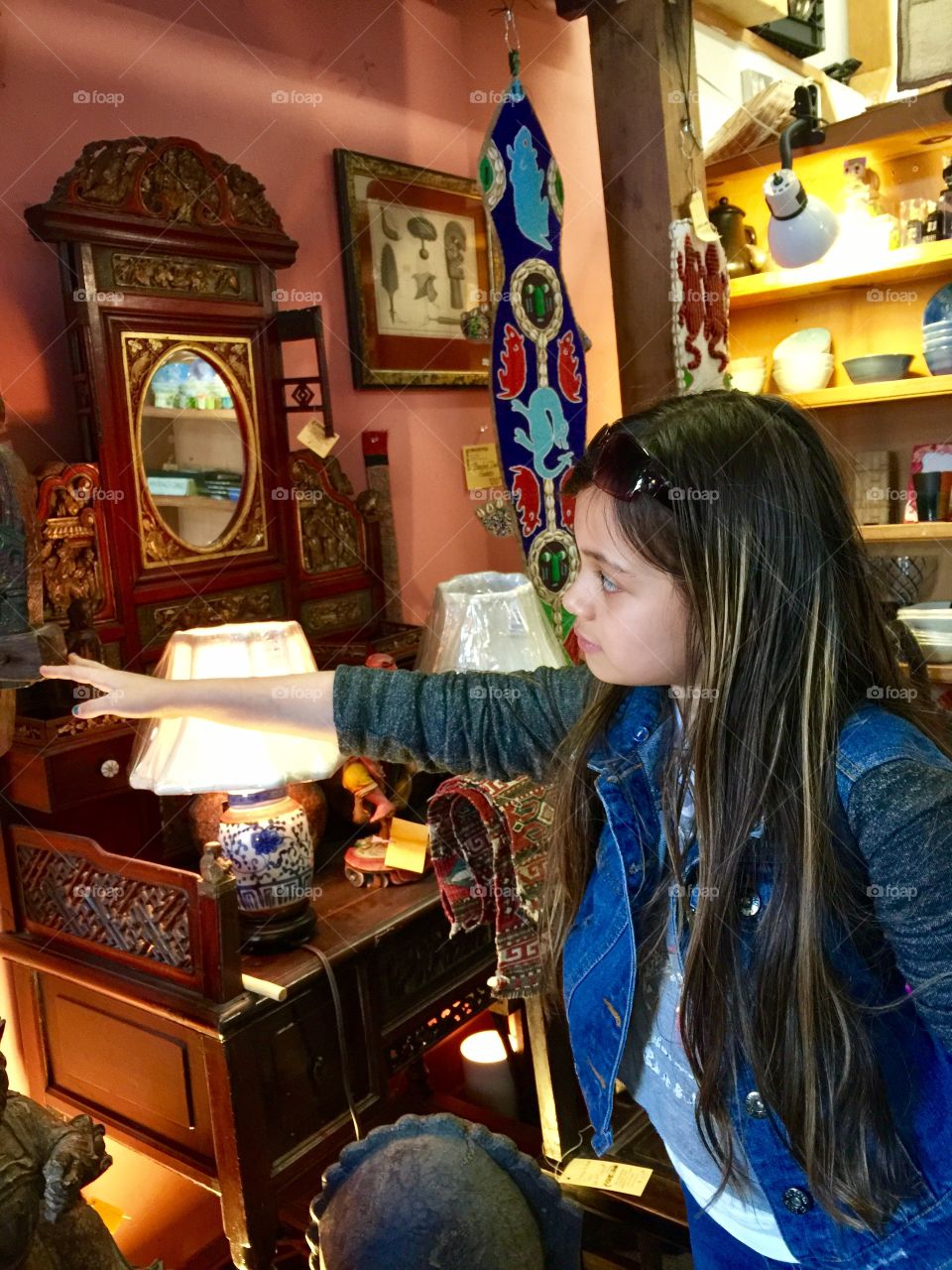 A little girl shopping at the Antique Shop 