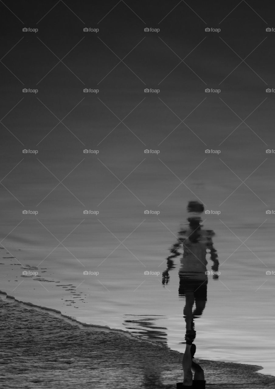 man walking on the beach