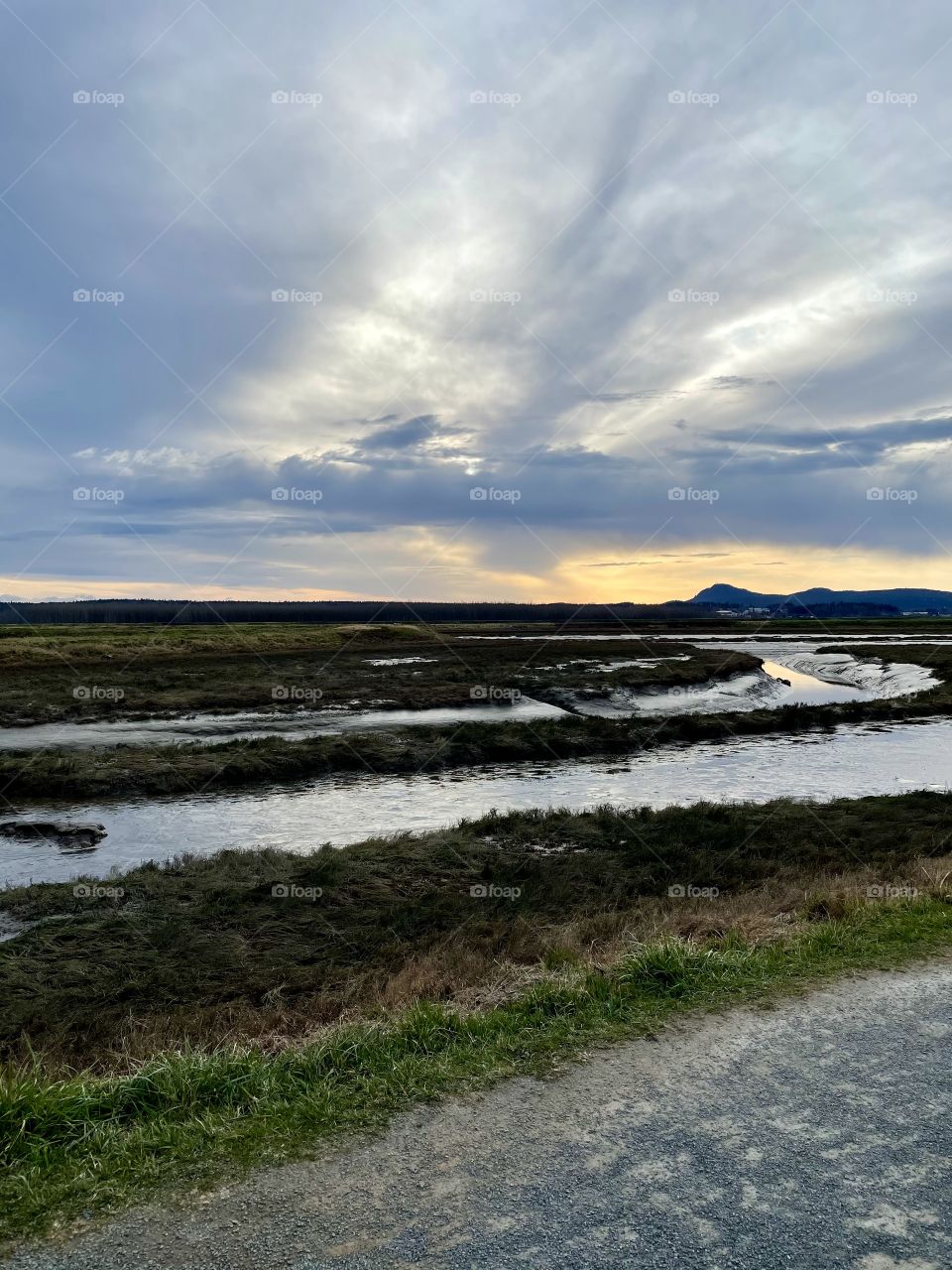 Rural trail with cloudy sunset