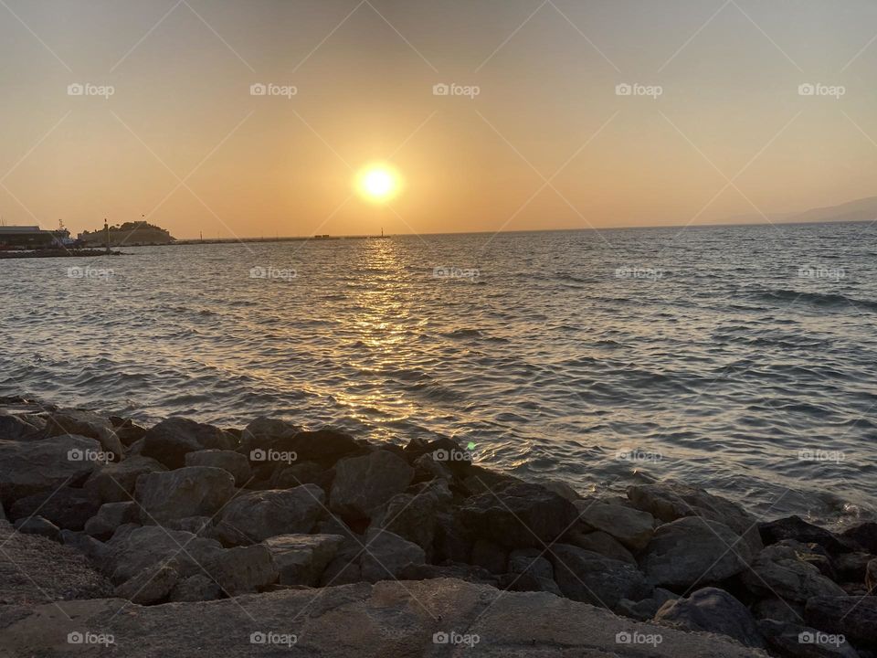 Beach time on holidays. Blue sky and tall palm trees. Sunsets and sunny days. Summertime in Kusadasi. Vacation travel in Turkey . Summer view. Sunny day during vacation