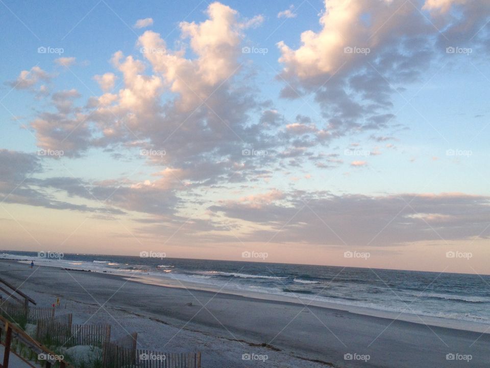 Peaceful beach walk. Sunset at the beach