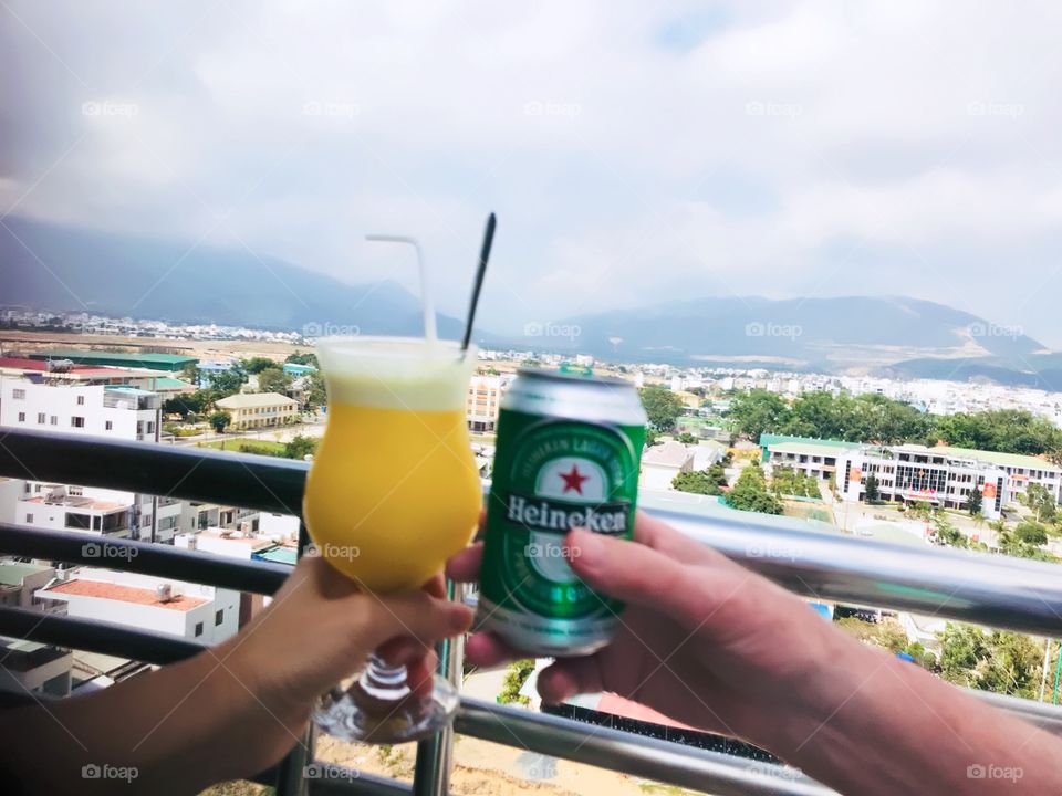 Time relax with Heineken beer and orange juice at the hotel with the view of Nha Trang City 
