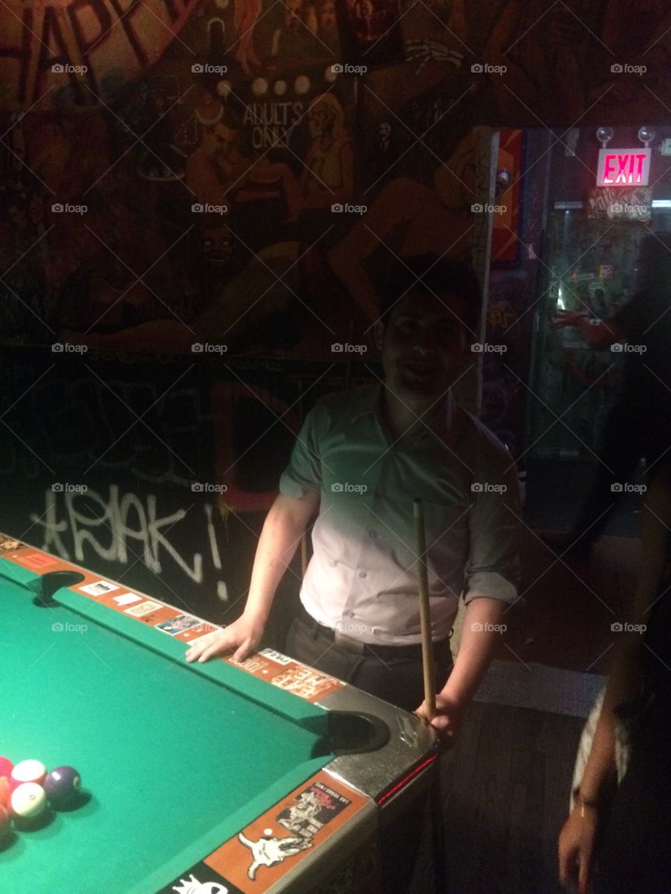 Playing pool at dive bar in new york city.