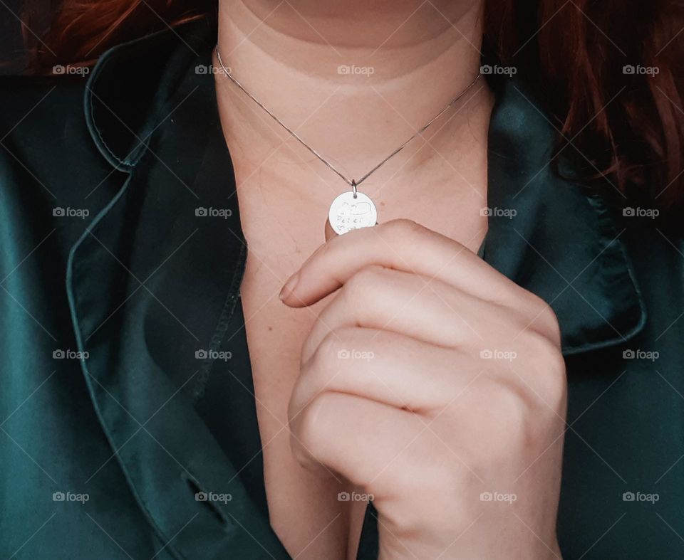 A silver pendant commemorating the first meeting