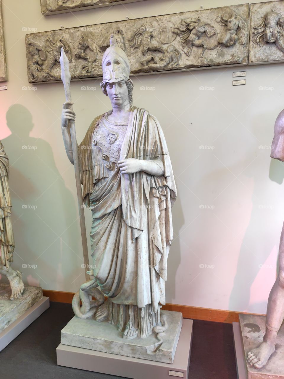 Stone figure of goddess Athens with spear and shield