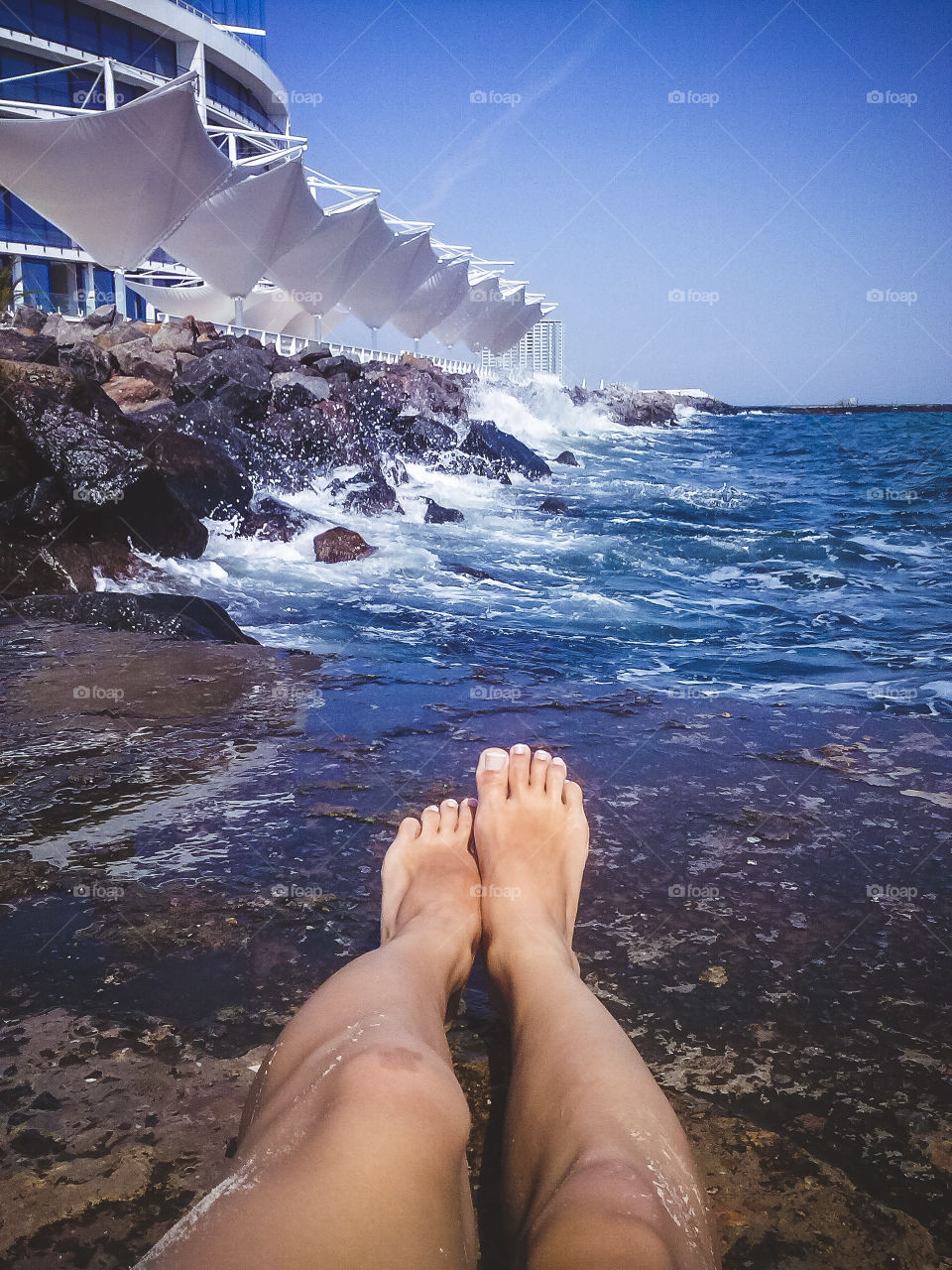 A person's feet at beach