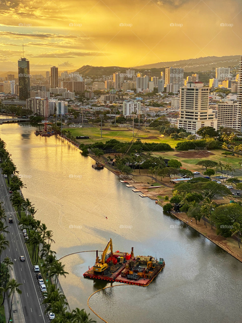 Dredging platform on the Ala Wai Canal in Honolulu, Hawaii at sunset