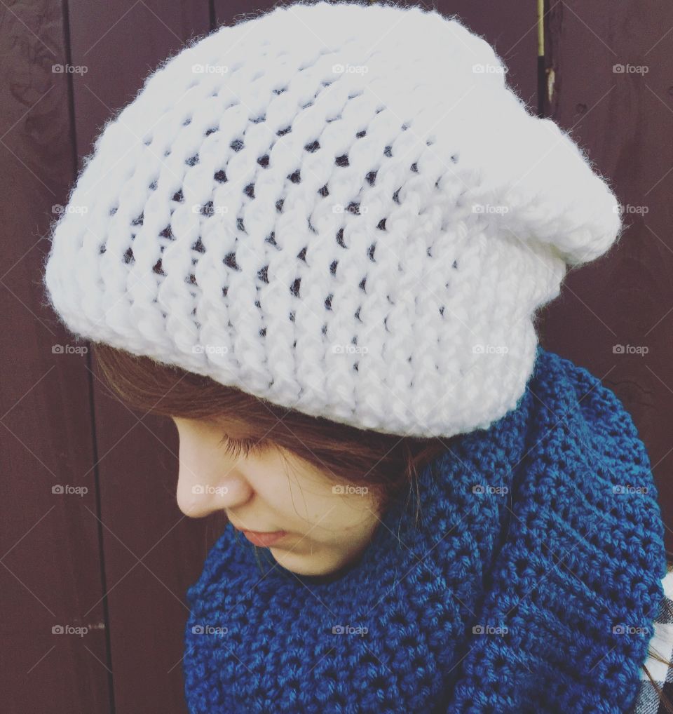Close-up of a teenage girl wearing woolly cap