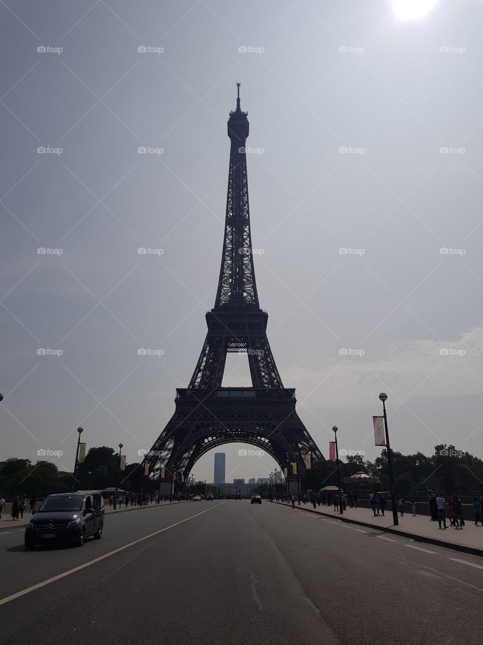 in the middle of the road in front of the eiffal tower