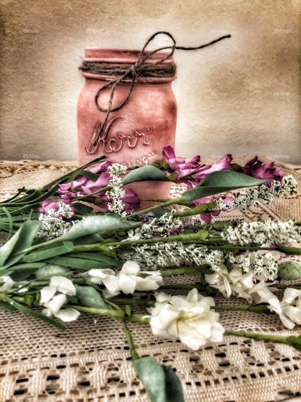 Pink Kerr mason jar antiqued with flower grouping lace vintage dollies