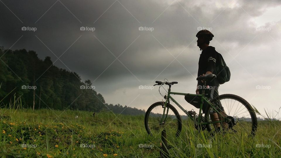 man cycling in mountain