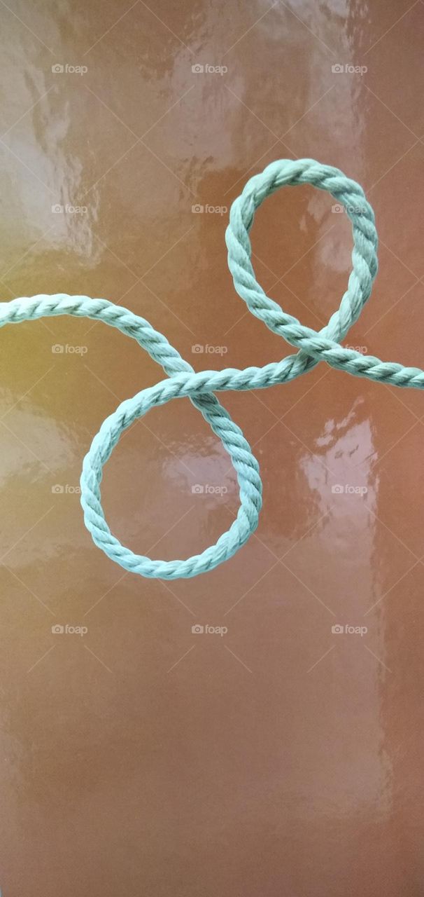 A picture of a piece of paper with a string on it