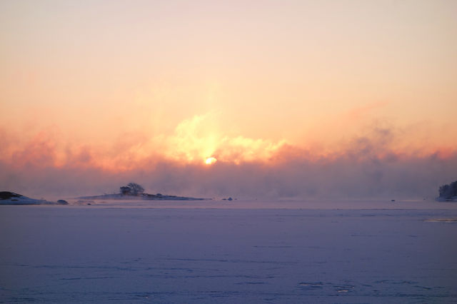 Winter sunrise by the freshly frozen Baltic Sea in Helsinki, Finland.