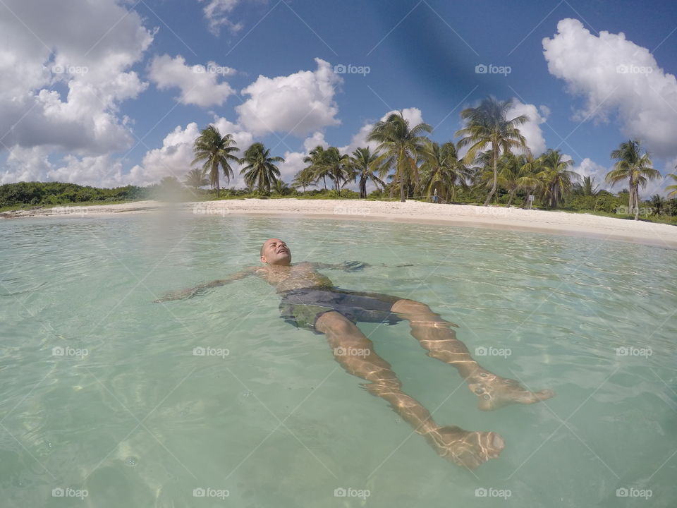 Man enjoying at tropical beach