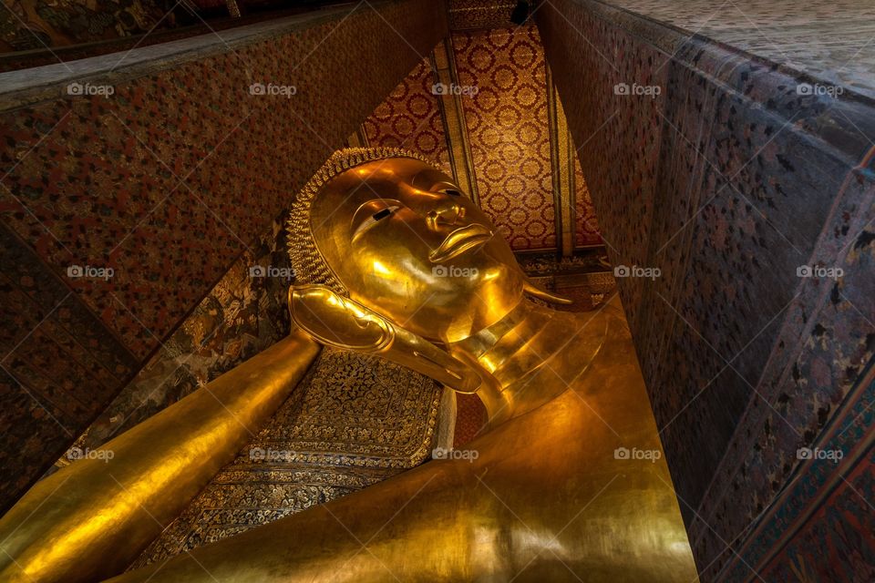 Close-up of gold coloured buddha statue