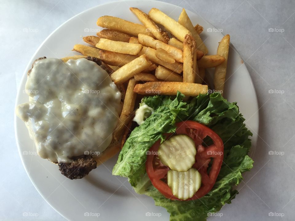 Lunch time with a juicy burger and fries