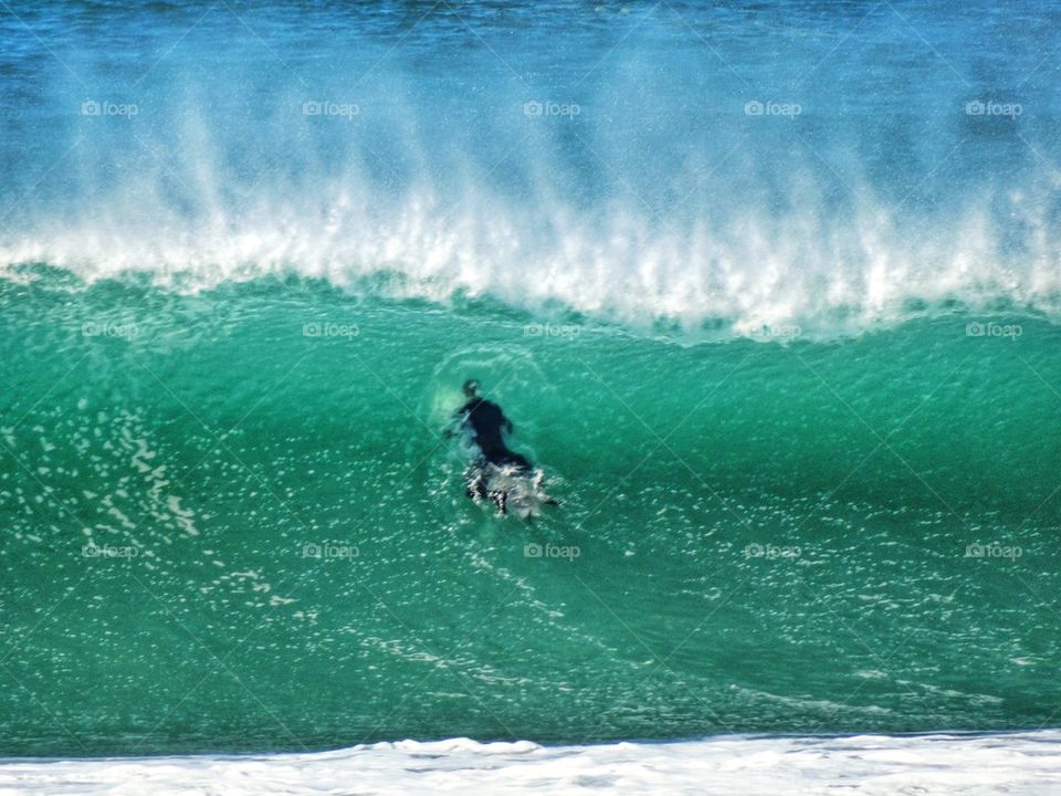 Surfer Taking On A Massive Wave. Big Wave Surfing

