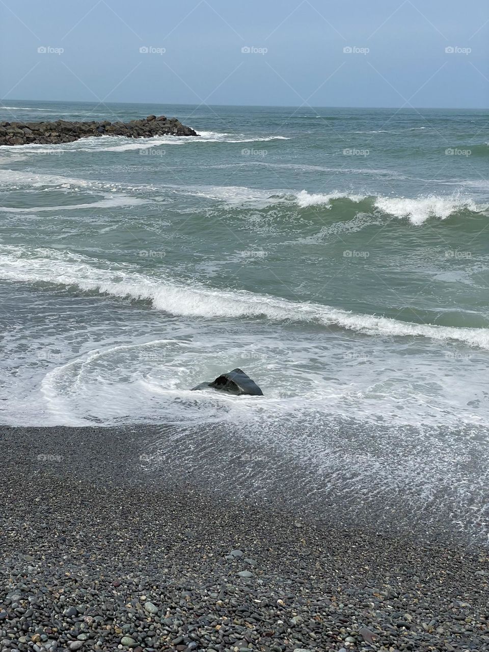 Waves crashing on a rock
