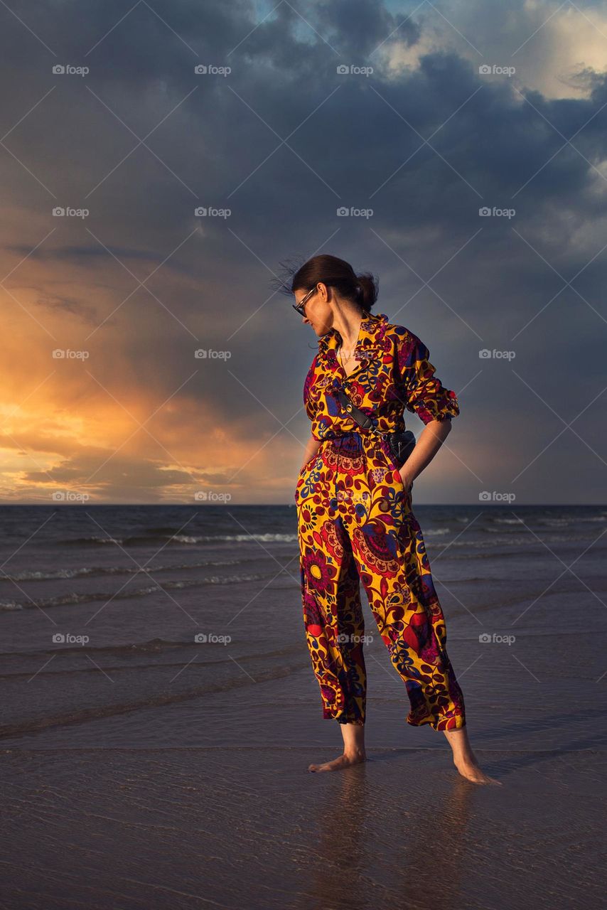 Floral outfit against a stormy sky