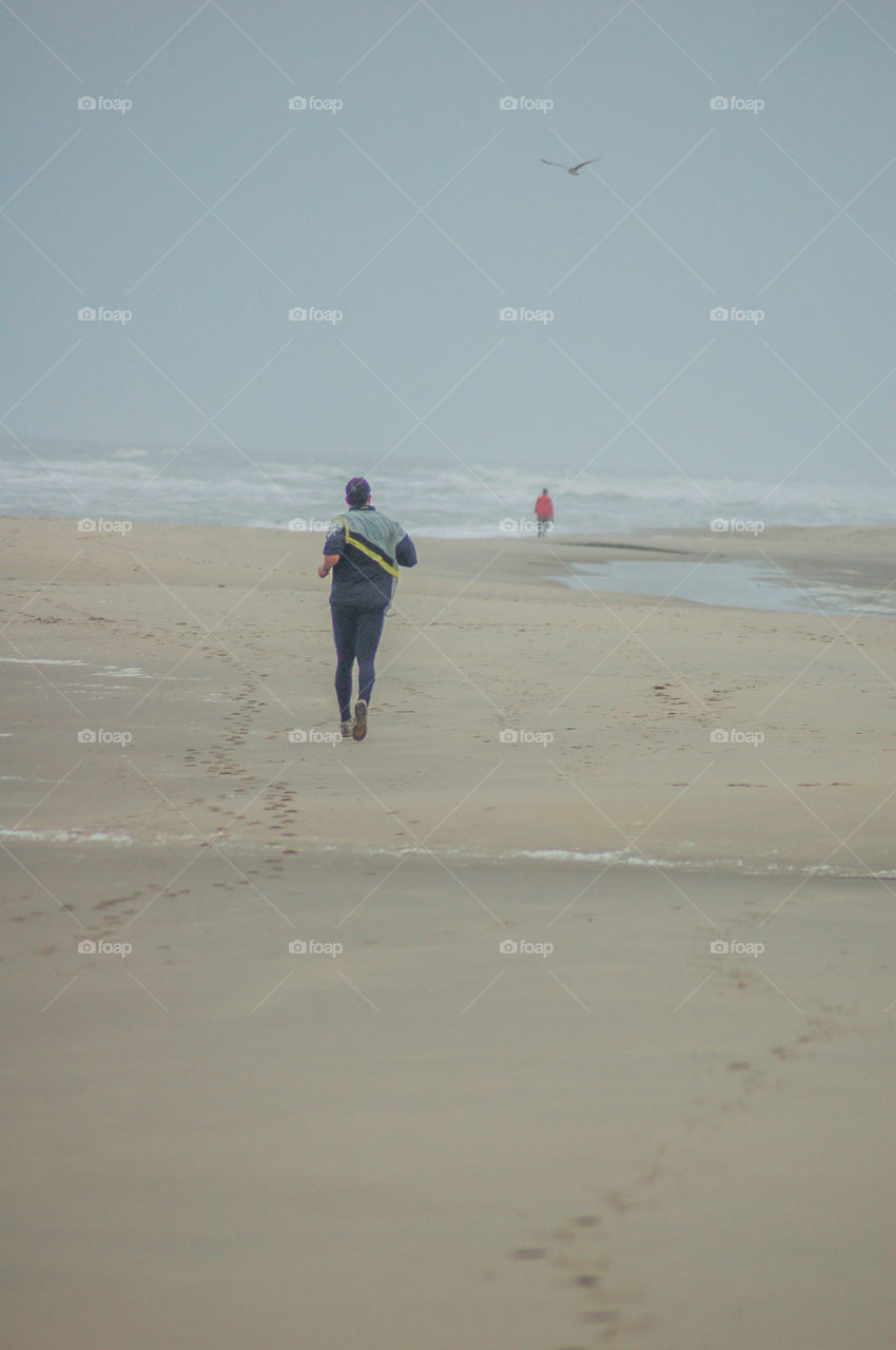 Man Running On The Beach