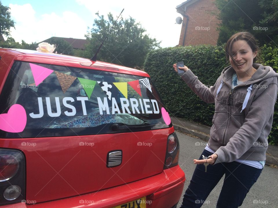 Just married car and bride