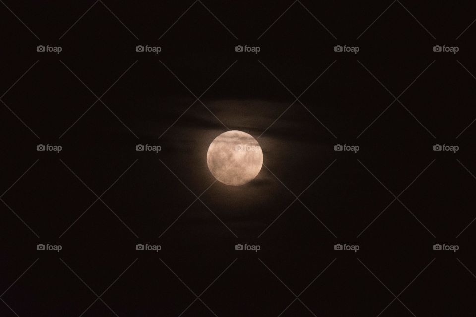 full moon shining in the night darkness