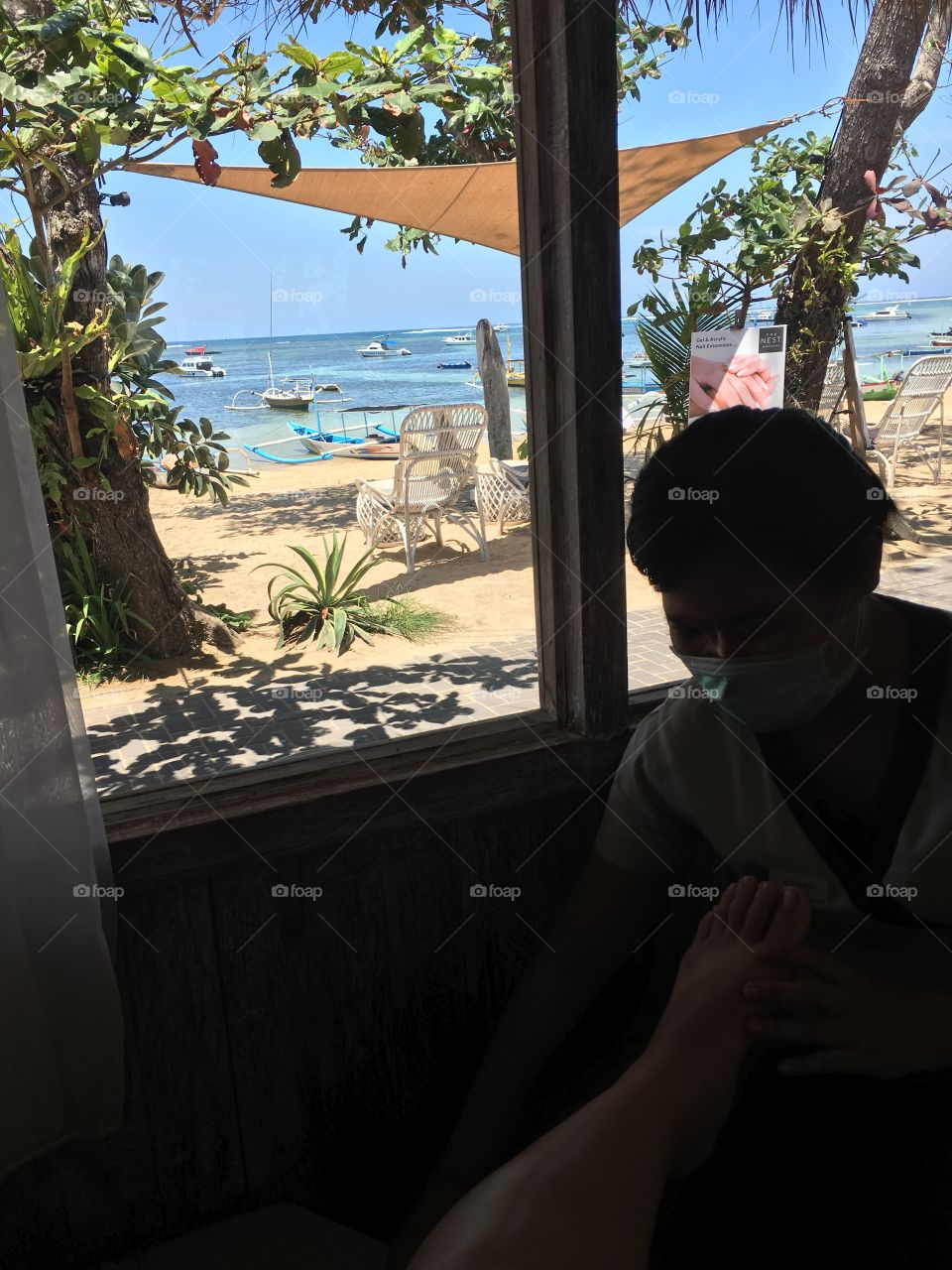 Foot massage by the beach in bali