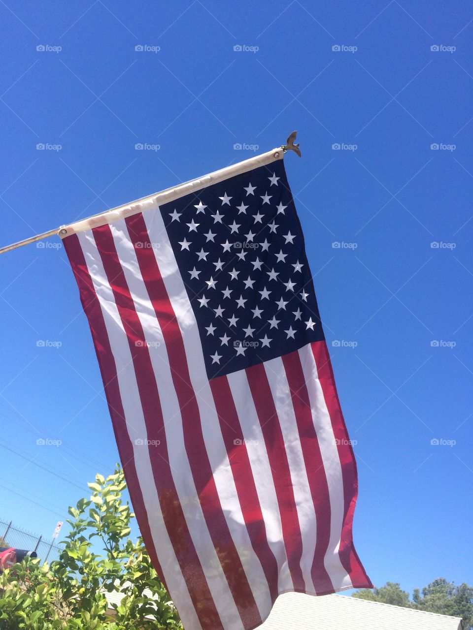 Flying high and proud. American flag flying