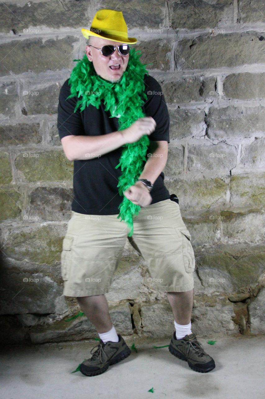 Young man standing in front of wall