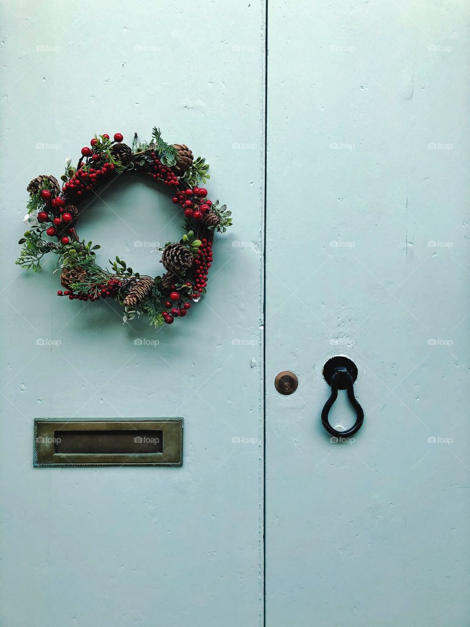 Christmas wreath on a traditional Maltese door, painted blue. 