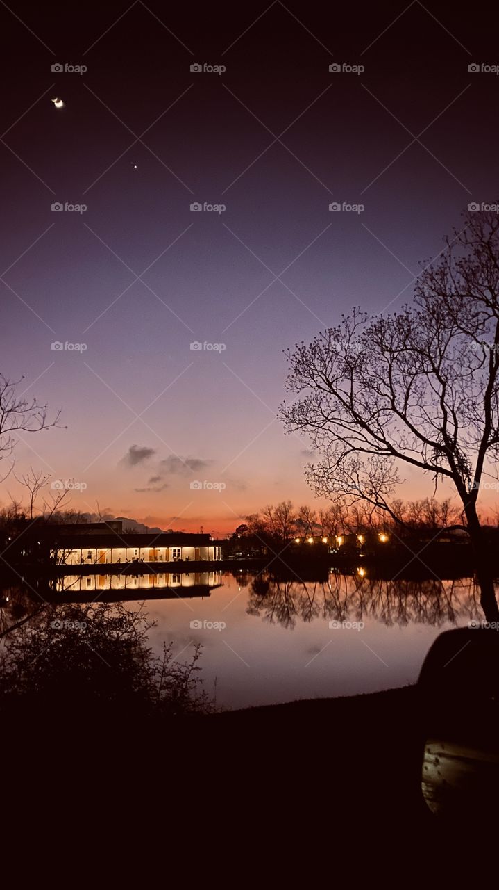 Perfect setting for Sun to Sunset with reflections of Lake Waters. Presence of calmness of offsetting color of sky to Lake Water. Silhouette of combining all Contributes into one setting.