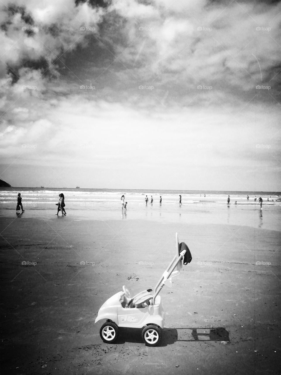 Baby carriage parked on the beach