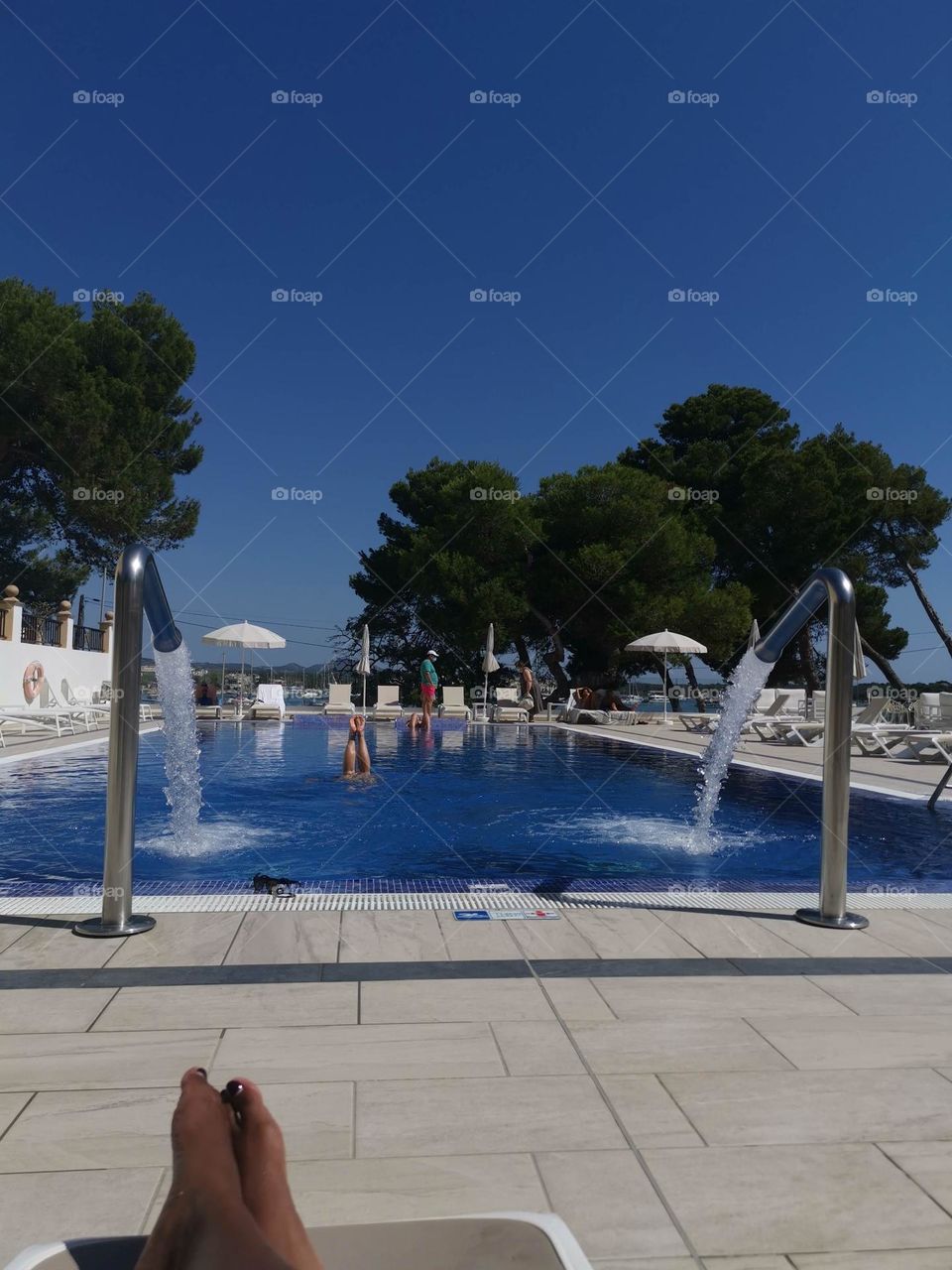 Synchronised swimmer in Spanish swimming pool