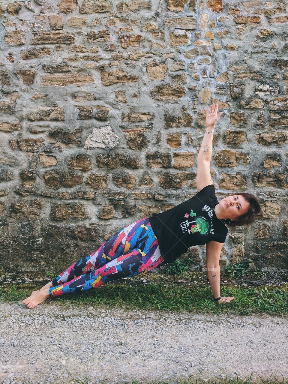 Portrait of beautiful young smiling woman doing yoga poses at the nature at spring. Healthy lifestyle