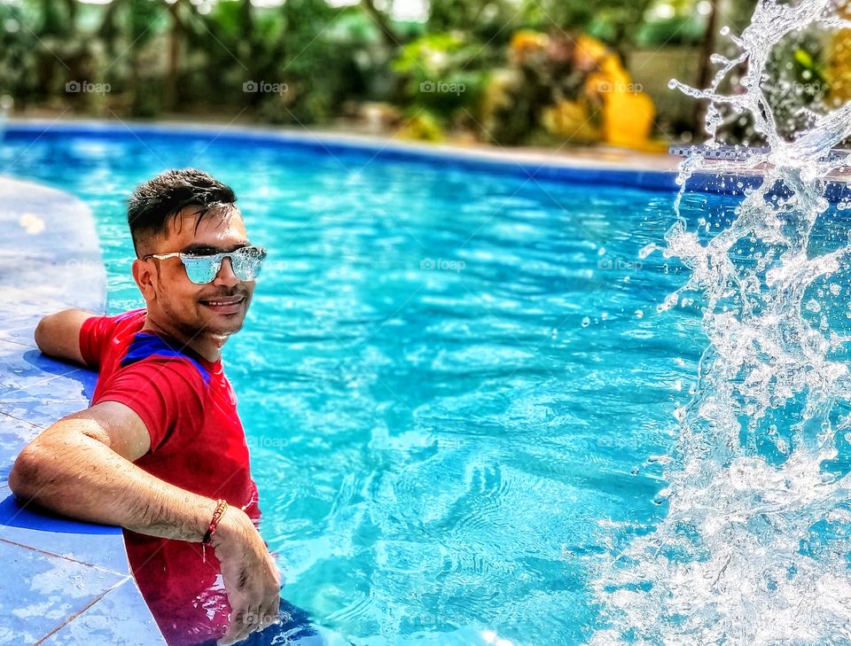 Man Standing in the swimming pool