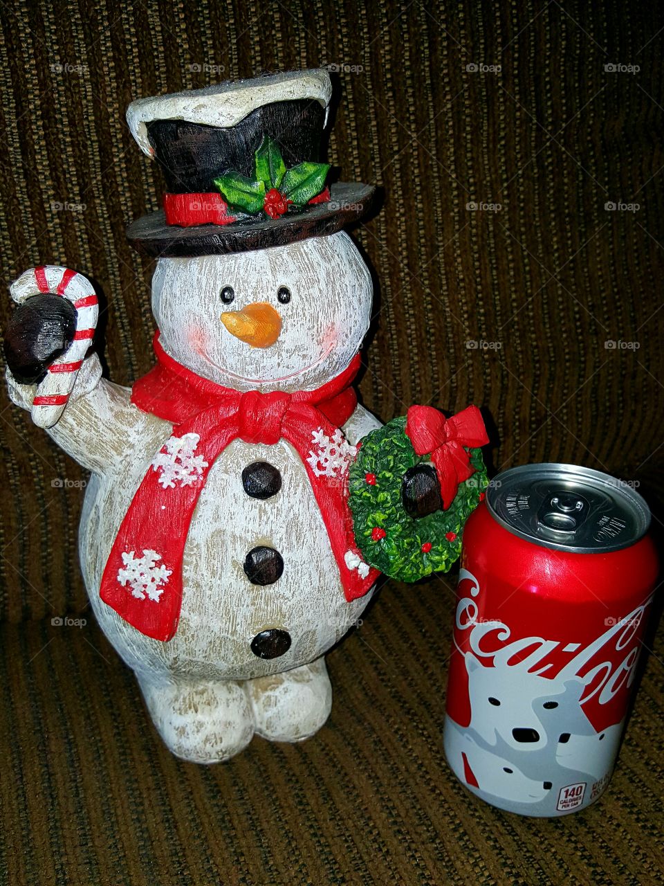 Like me, Frosty enjoys relaxing with a refreshing sip of Coca Cola from time to time!