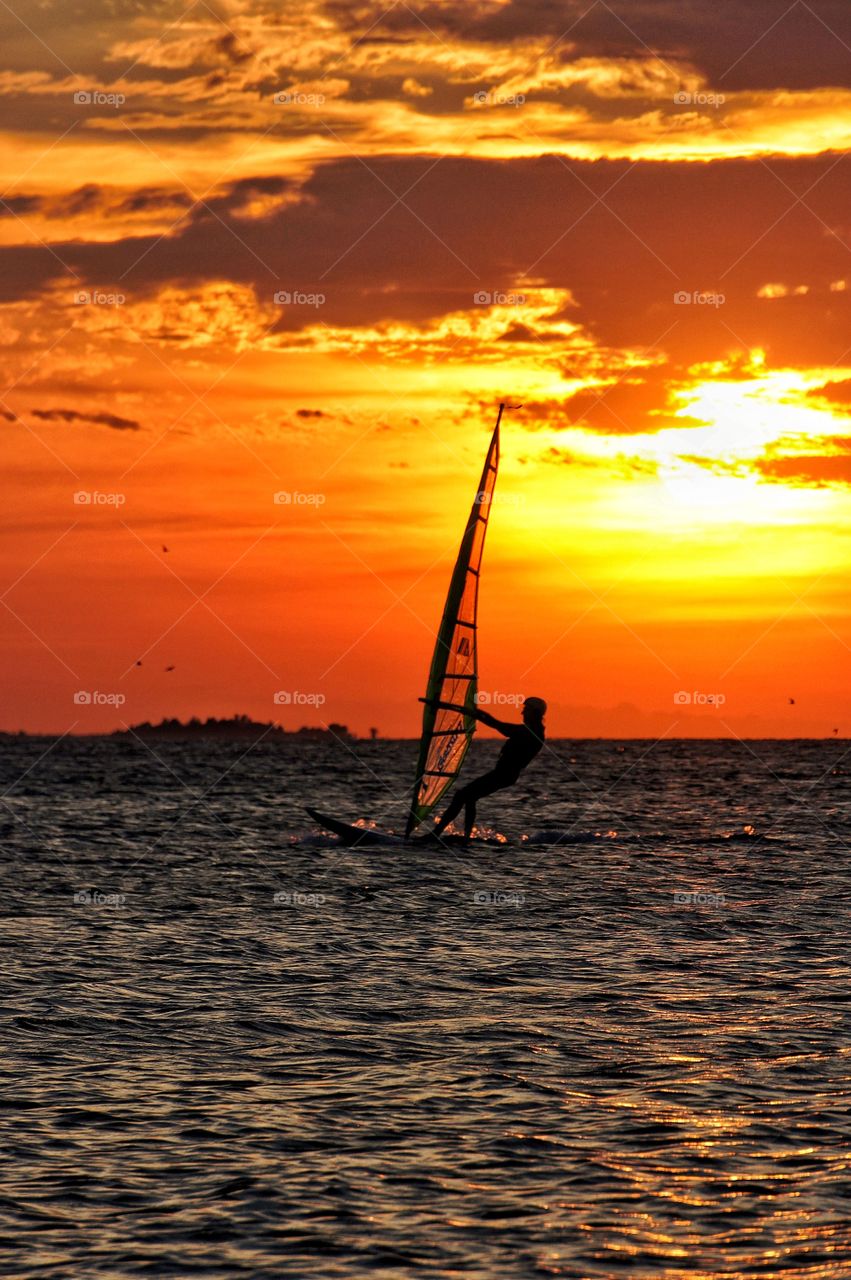 Windsurfer in sunset