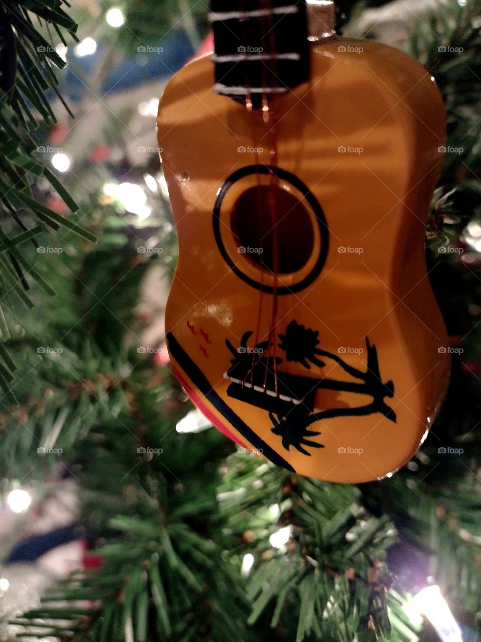Unfiltered, beautiful, lovely close-up of a Christmas guitar ornament for the Holidays
