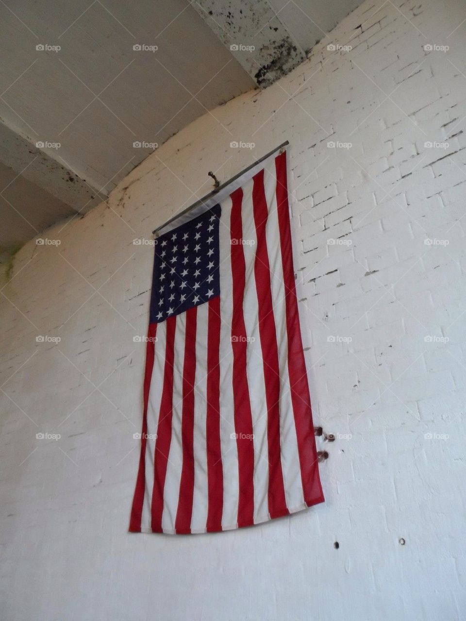 American flag, stars always hanging in the top left corner